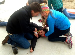 Austin and Emma making sure to clear Becca's airway during an afternoon simulation.